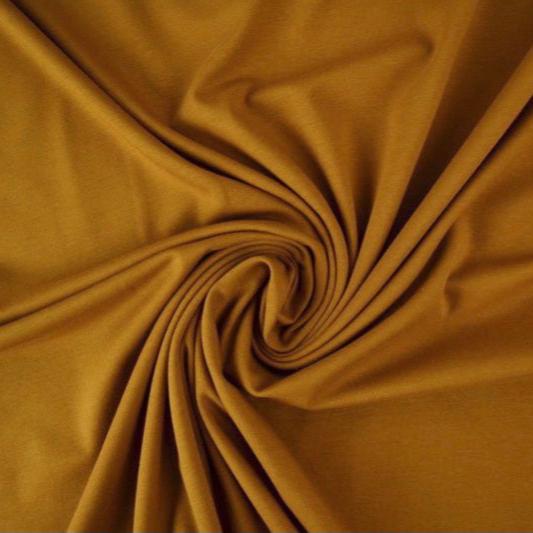 MØRK KARRYGUL BOMULDSJERSEY – NATURLIG, ÅNDBAR & STRÆKBAR