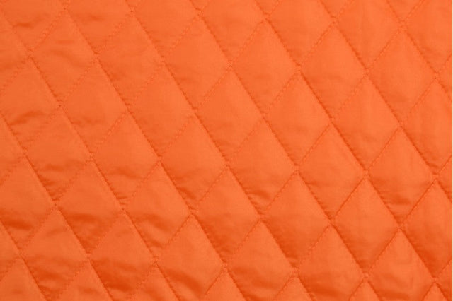 ORANGE QUILTAT TYG MED VADDERAD BAKSIDA