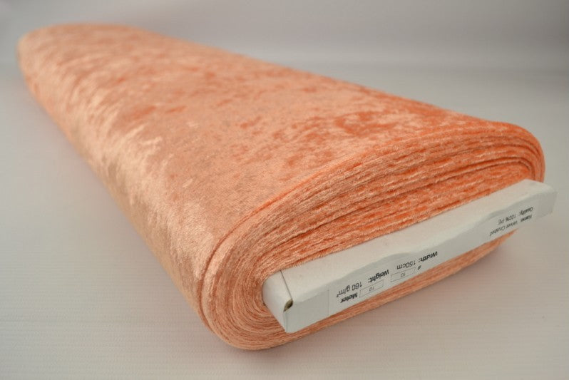 ORANGE NERVØS VELOUR – STRIKKET, STRÆKBAR & GLANSFULDT FALD