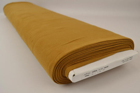MÖRK CURRYGUL BOMULLSJERSEY – NATURLIG, ANDNINGSBAR & STRETCHIG