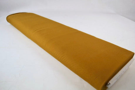 MÖRK CURRYGUL BOMULLSJERSEY – NATURLIG, ANDNINGSBAR & STRETCHIG