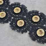 SORT BLOMSTERBÅND MED GULD RINGE 55MM
