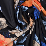 SVART LYCRA – TROPISKT BLOMMÖNSTER, 4-VÄGS STRETCH & SNABBTORKANDE